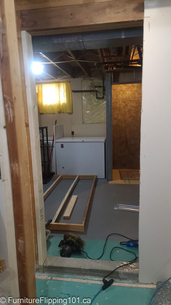 cutting a doorway into a load-bearing basement wall studs removed